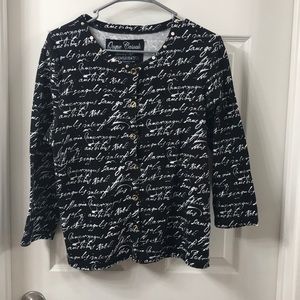 Cute little cardigan sweater with writing.